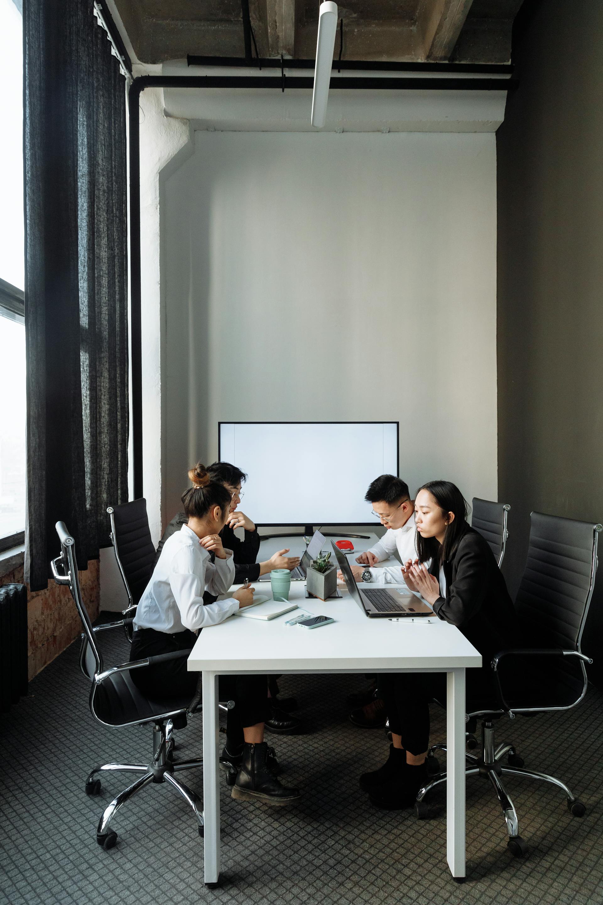Satrio Consulting consultants in a meeting